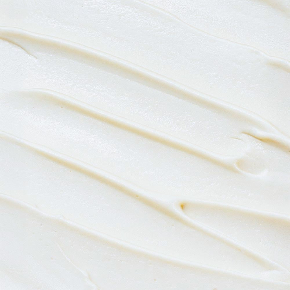 Close-up of smooth creamy texture of HERLOW grass-fed tallow balm for skin nourishment