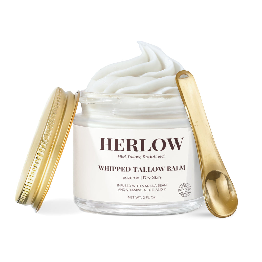 HERLOW grass-fed tallow balm whipped in a clear jar with gold lid and spoon for dry skin