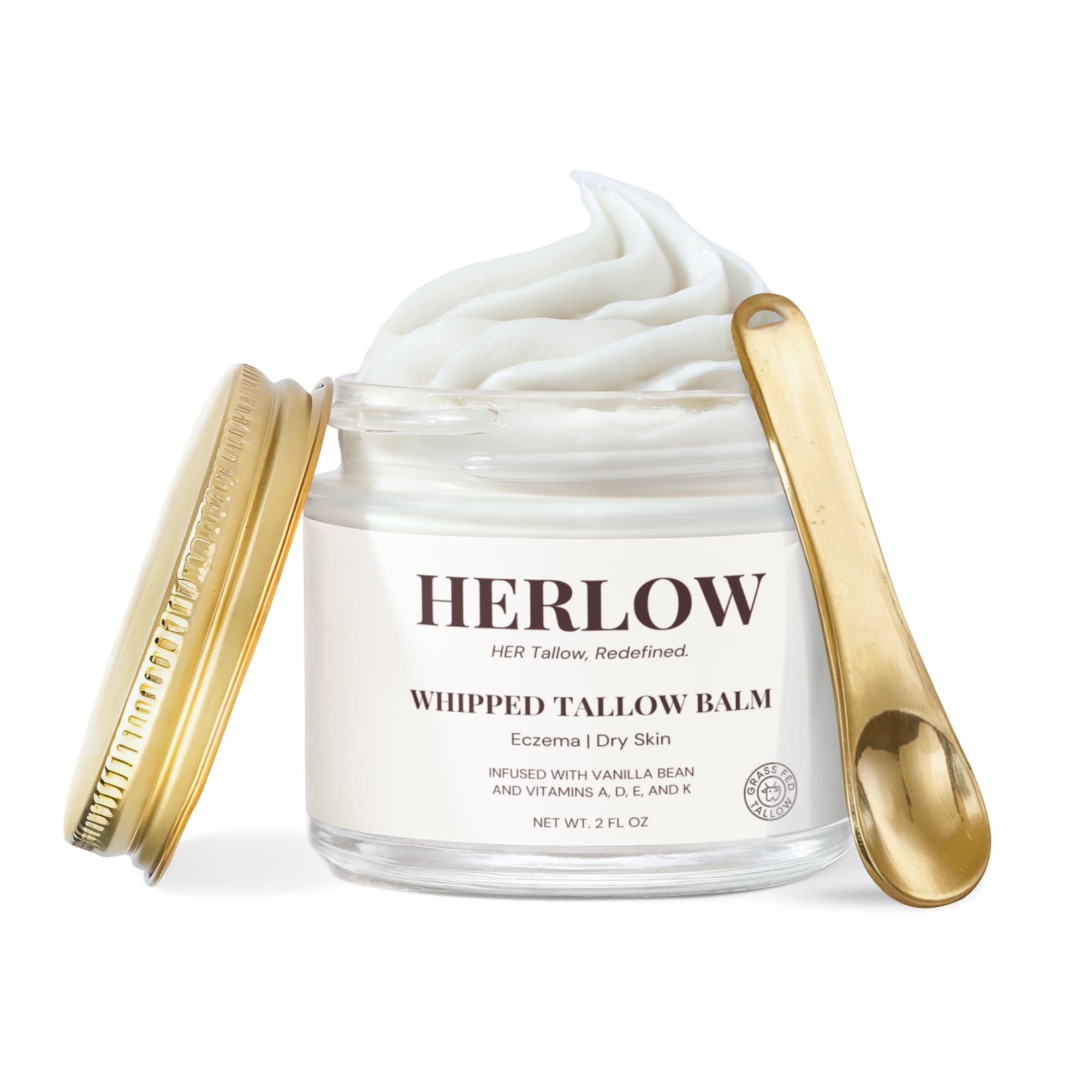 HERLOW grass-fed tallow balm whipped in a clear jar with gold lid and spoon for dry skin