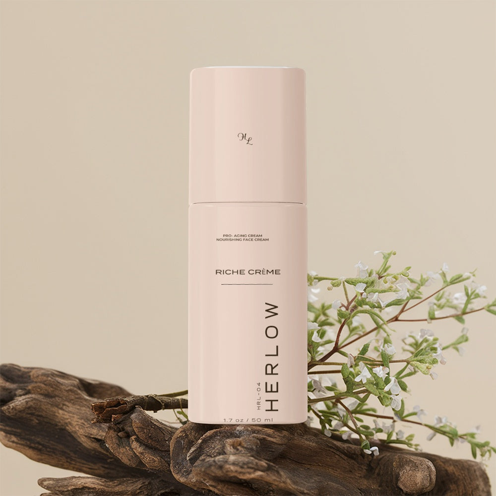 HERLOW Riche Cream pro-aging face cream in a stylish bottle with natural decor