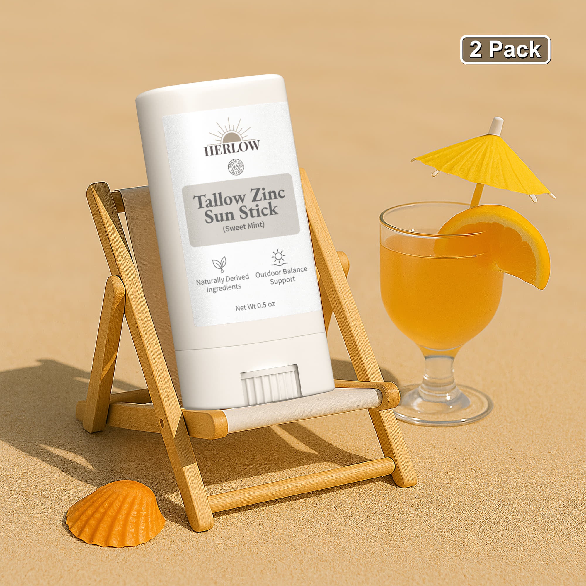 HERLOW Tallow Sun Stick in Sweet Mint on a beach with a drink and lounge chair