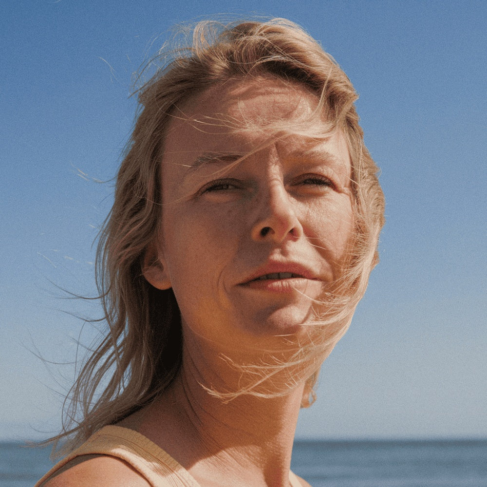 Woman enjoying the outdoors using a tallow sun stick for sun protection